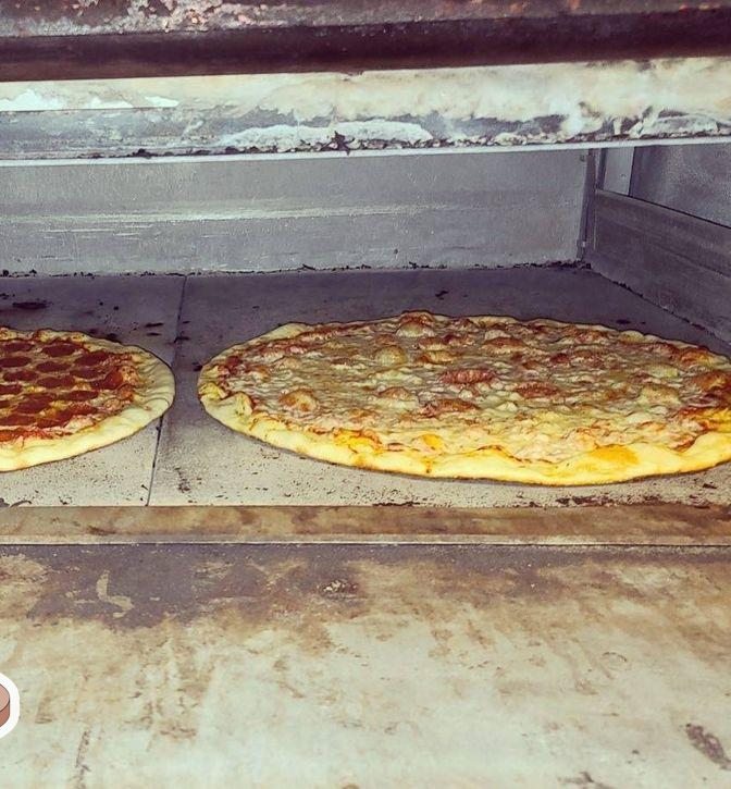 Twenty-inch pies in the oven at Tony's