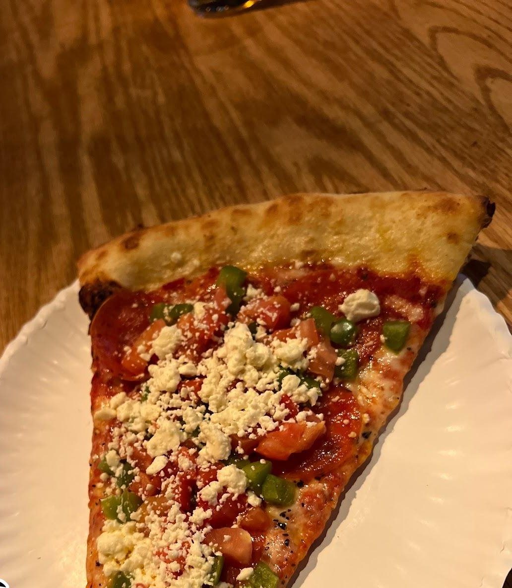 A New York-style slice from Tony's on a paper plate